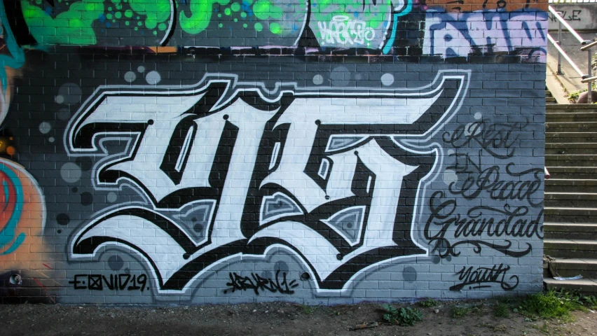 graffiti is seen on the side of a wall