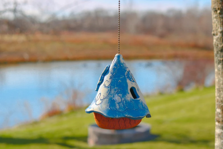 there is a small birdhouse shaped like a fish