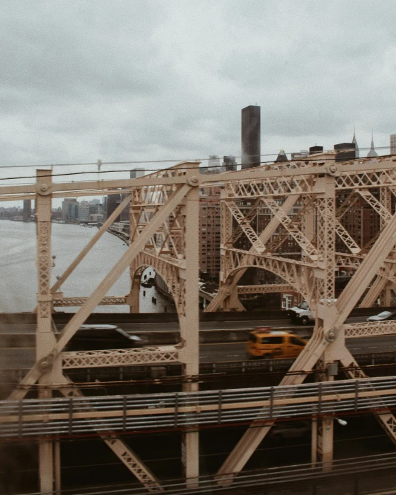 view of two cars on train tracks and the city's skyline