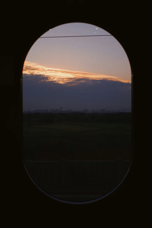 view of an open field through an arc