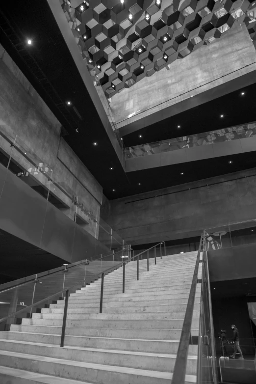 a very long set of stairs with some lights above it