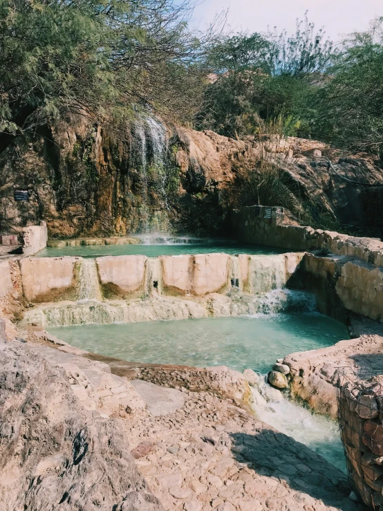  springs with  water surrounded by some rocks