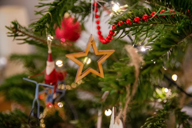 christmas tree ornaments are decorated with lights