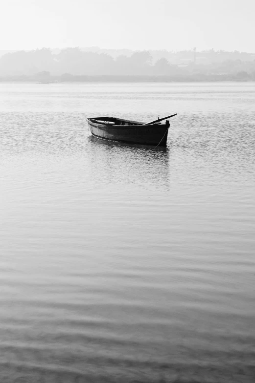 a row boat is floating on the water