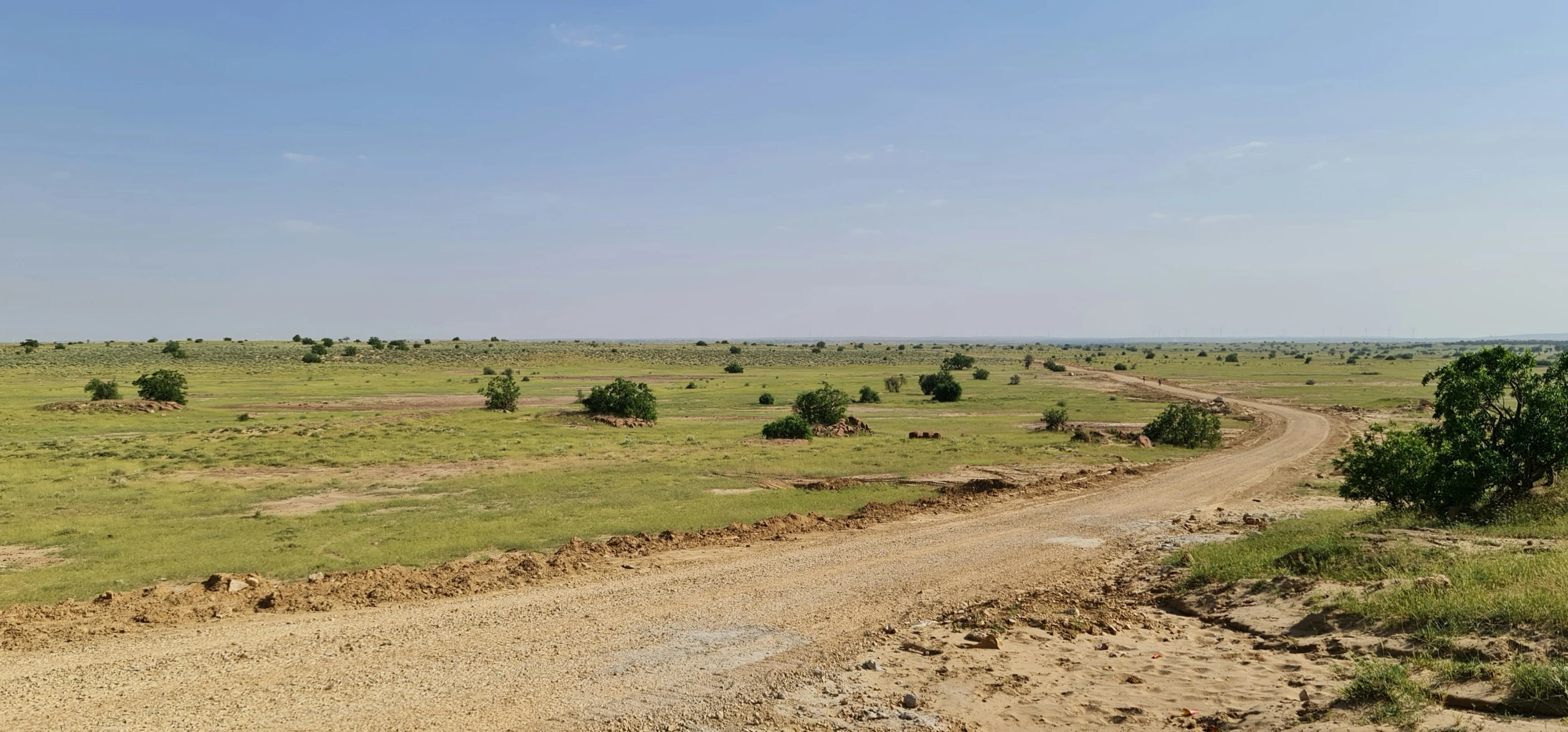 a dirt road that is in the middle of nowhere