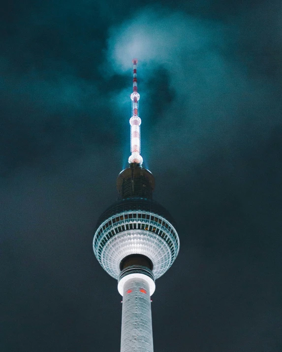 the television tower towering above the city at night