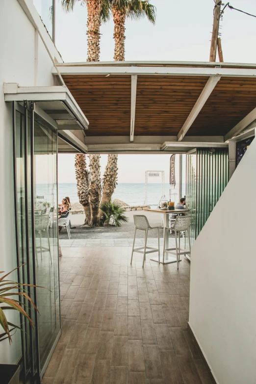 there is some chairs outside under an open air roof