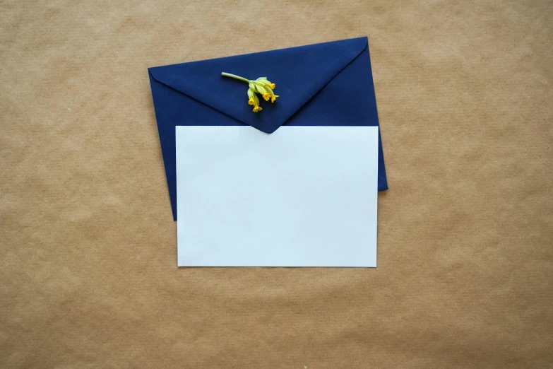 a sheet of paper taped to the bottom of an envelope