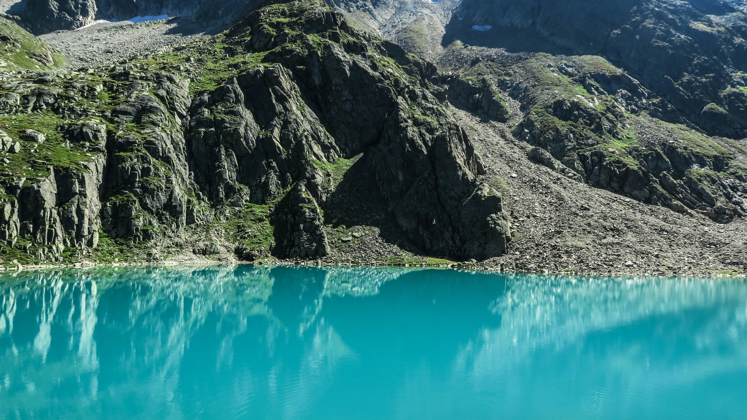 a mountain in the back ground with water