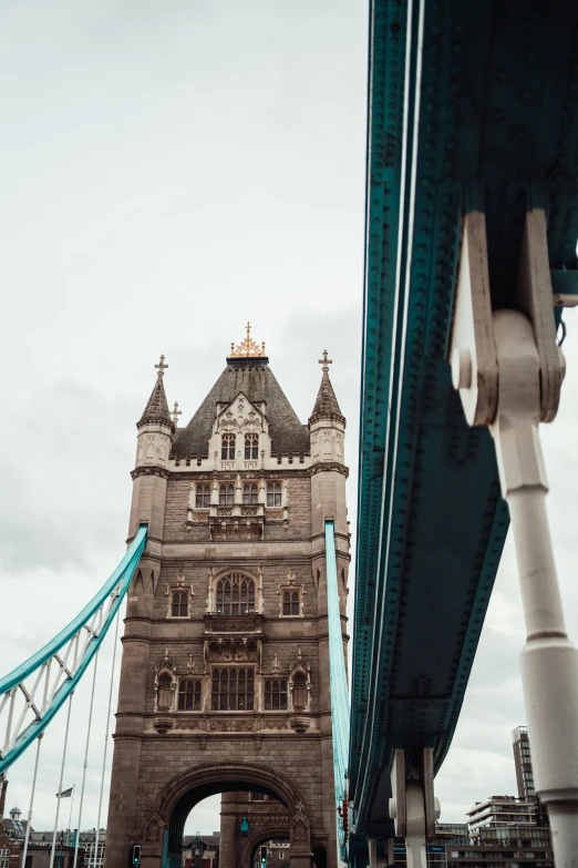 a bridge going over a river in front of buildings