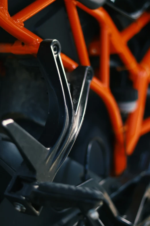 a bicycle has orange handles and black frames