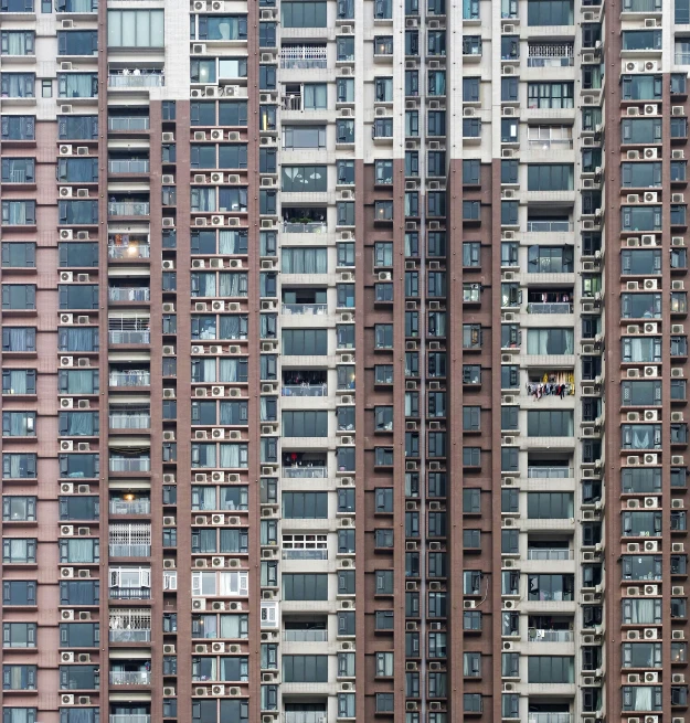 many apartment buildings in the city with windows missing