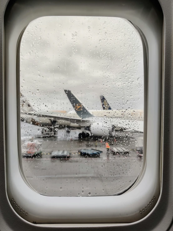 an airplane in the air on a rainy day