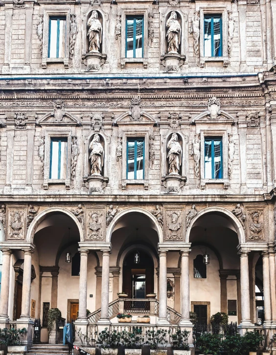 a tall building with lots of arched windows