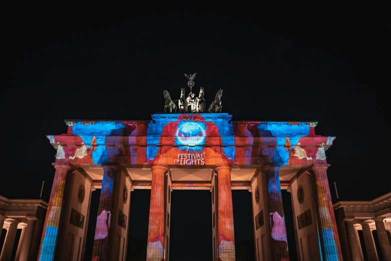 a very colorful and interesting arch in the night time