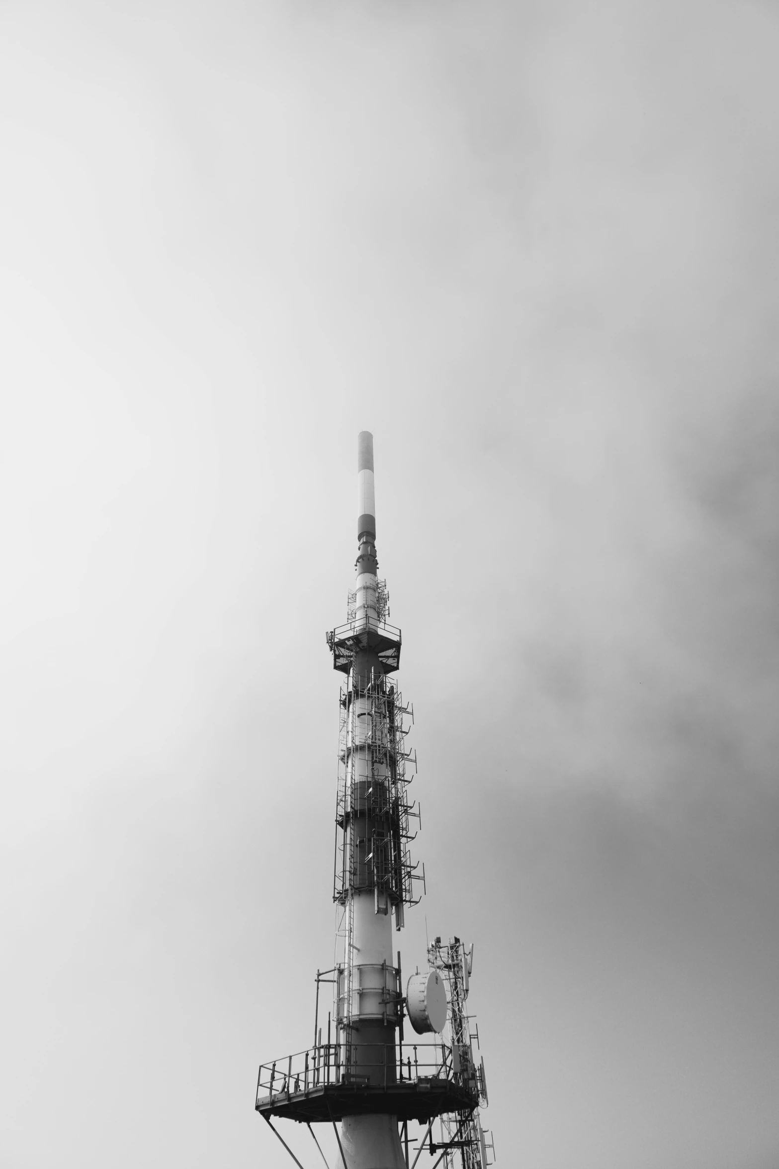 a tall tower with some people standing under it