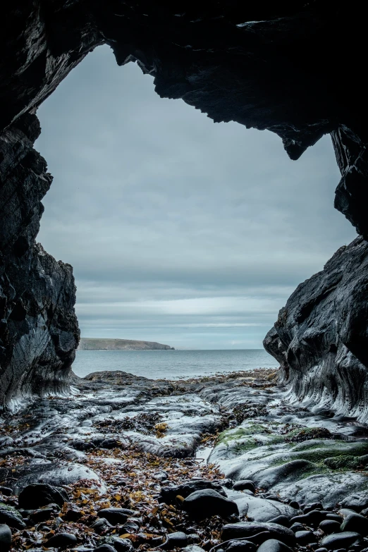 the ocean is covered in snow and rocks