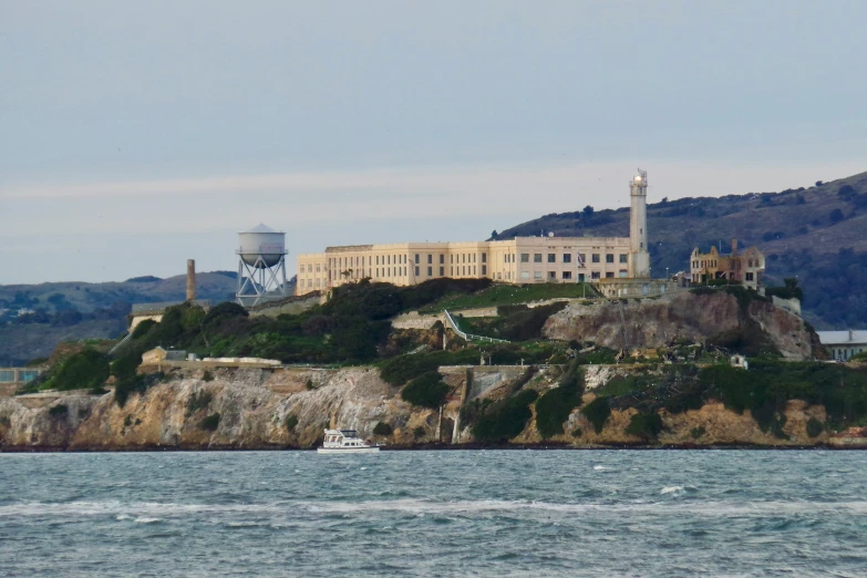 a large building on a small island in the middle of water