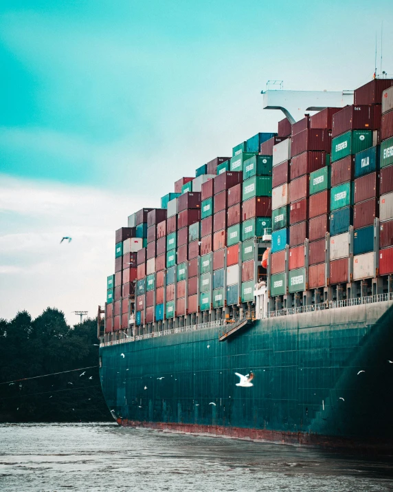 an image of large cargo ship with many containers