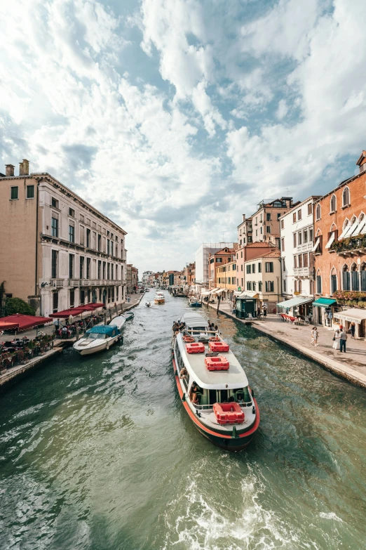 a boat going down the river in venice