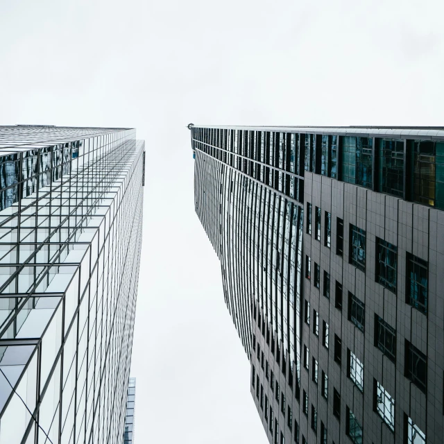 the two large buildings are mirrored in each other