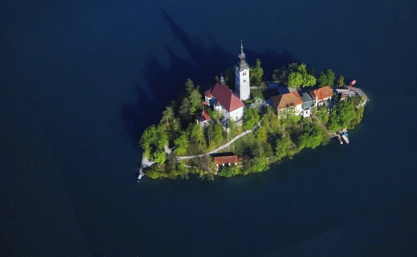 an island is surrounded by a group of houses