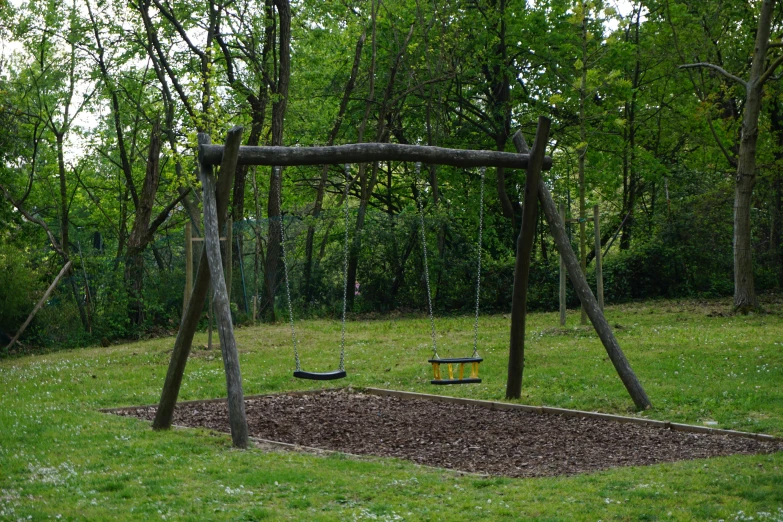 the wooden swings are all set up to be used as a play area