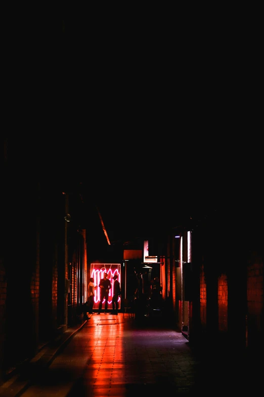 night time city lights on brick building with shadows