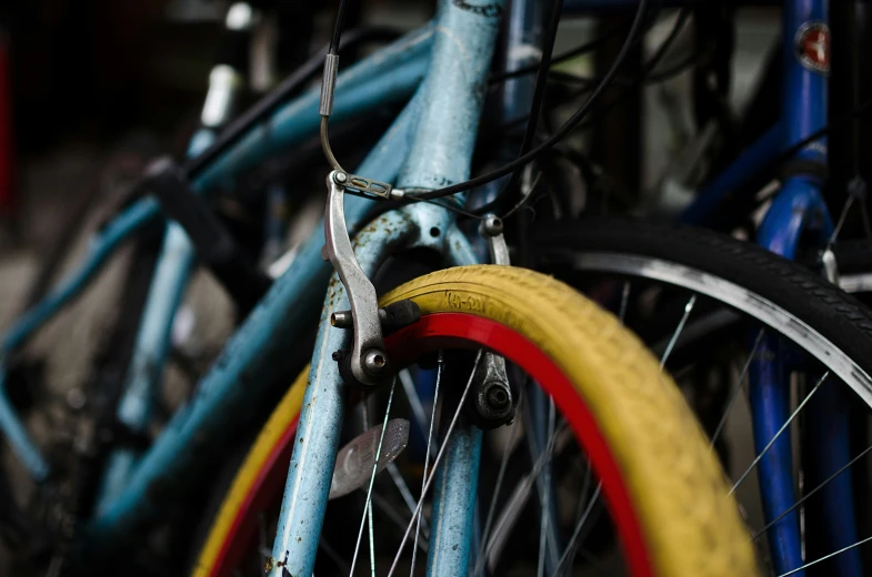 two bikes parked close together near each other