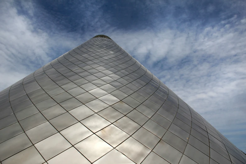 looking up at the top part of an angled building