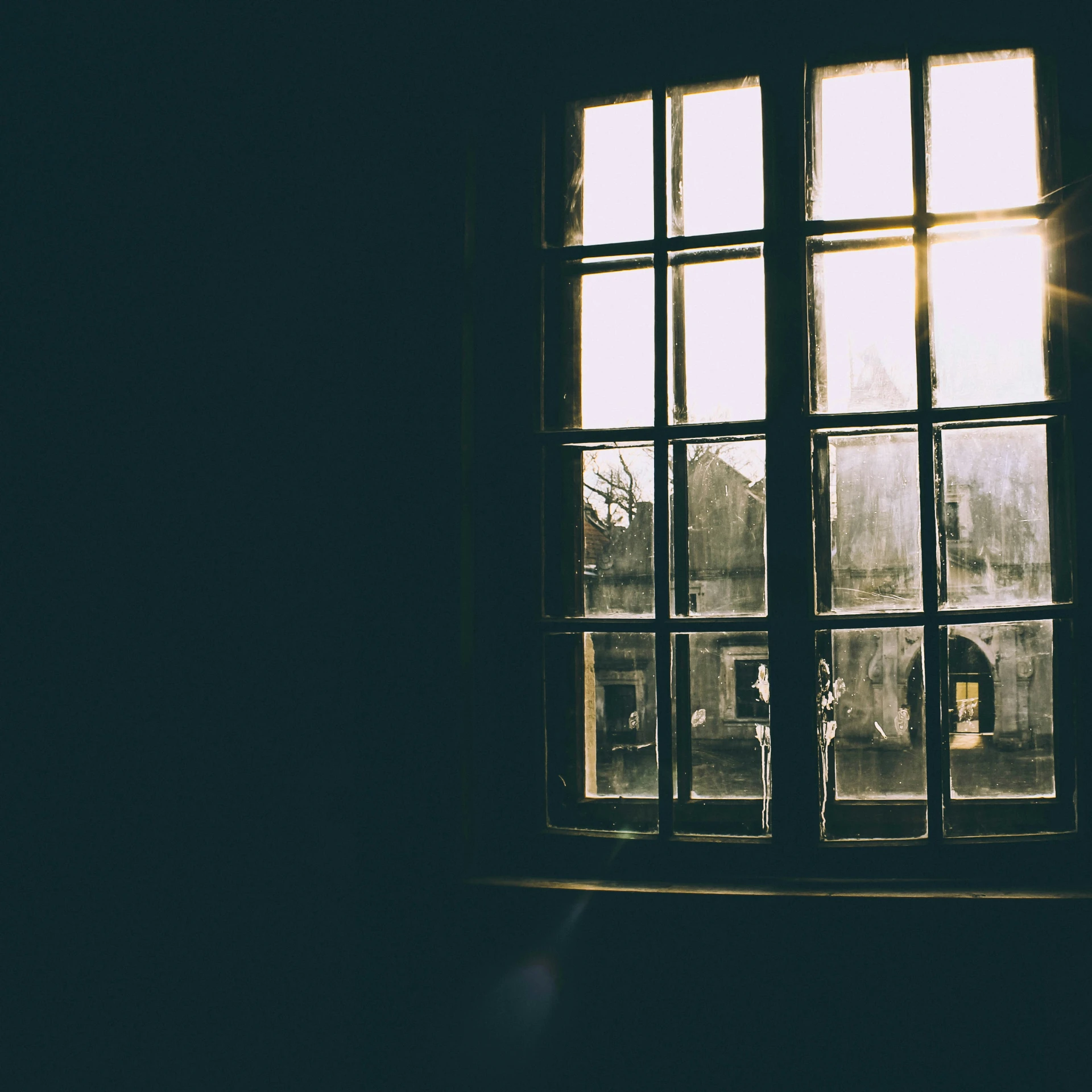 a window is open and the view of buildings