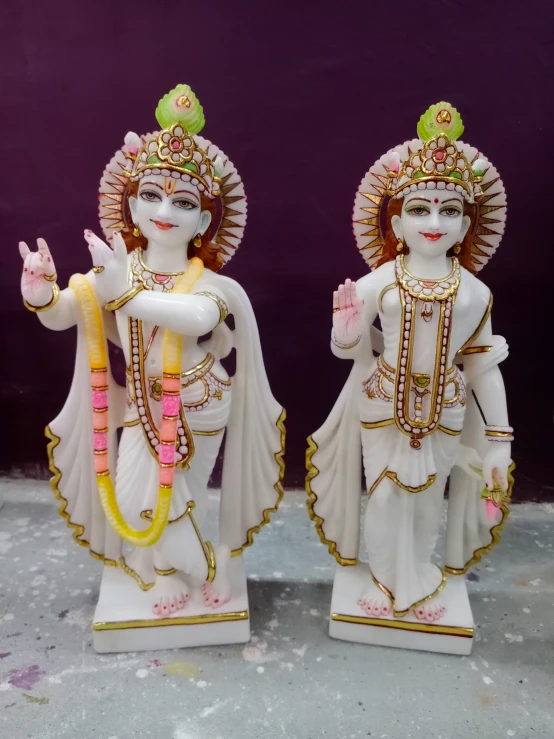 statues of hindu deities are displayed for customers