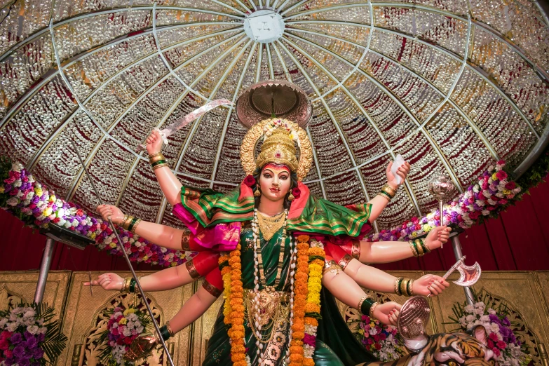 a very pretty and colorful god statue in a big room