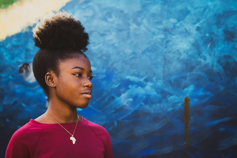 a young person with a strange afro hairstyle