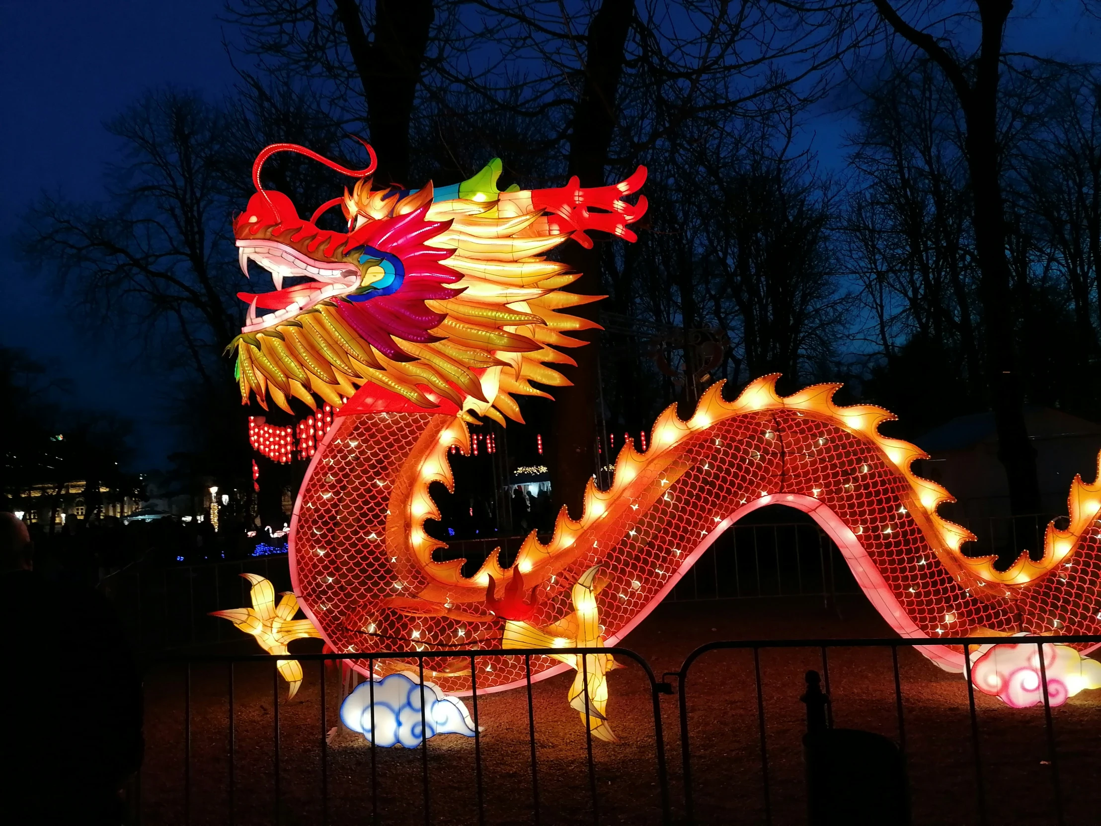 a chinese themed light display on the sidewalk