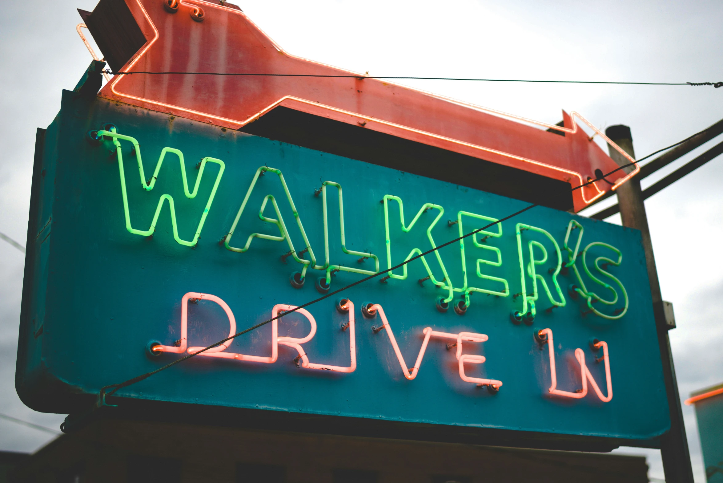 a green sign is lit up for the camera