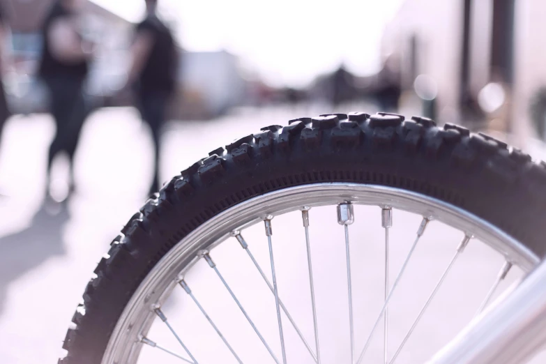 a tire and rims on a bike outside