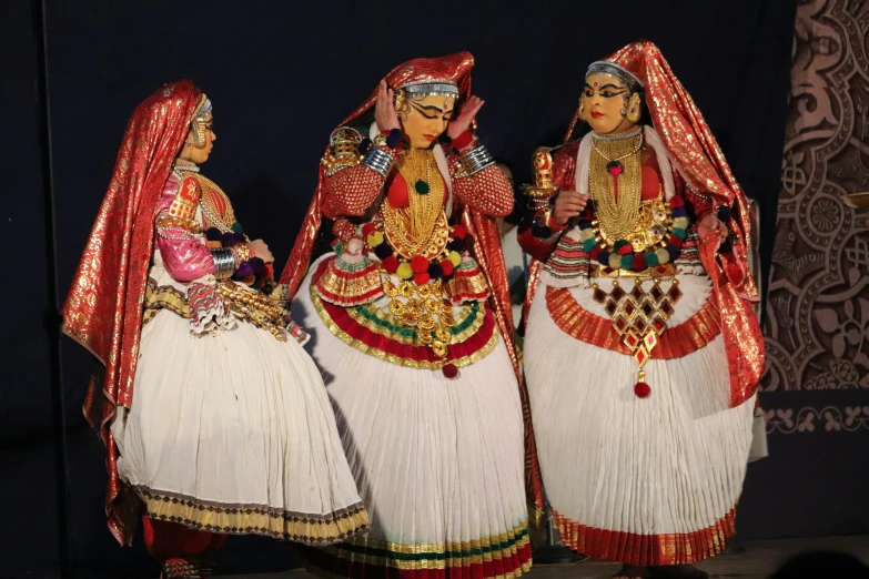 four indian dolls stand beside each other