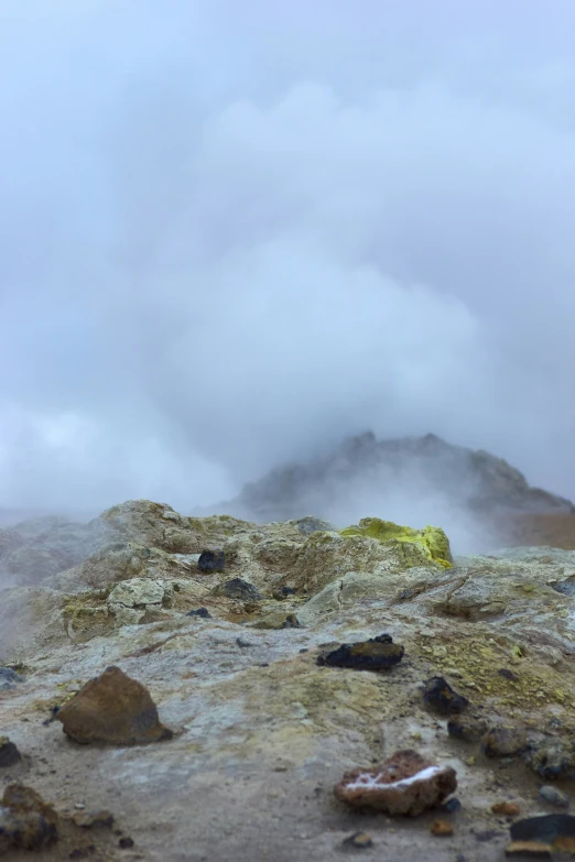 a single yellow object on top of the rocks