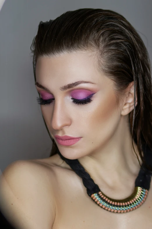 a woman with her face painted bright pink