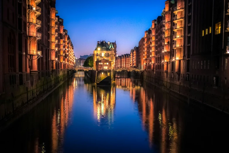 a body of water in front of several buildings