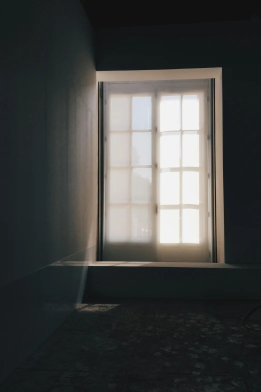 a room that has the window open in the day