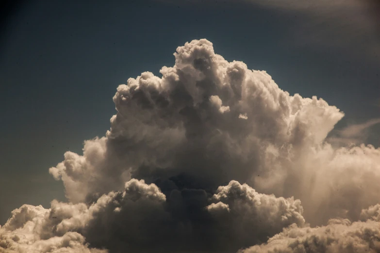 the view from an airplane of clouds in blue sky