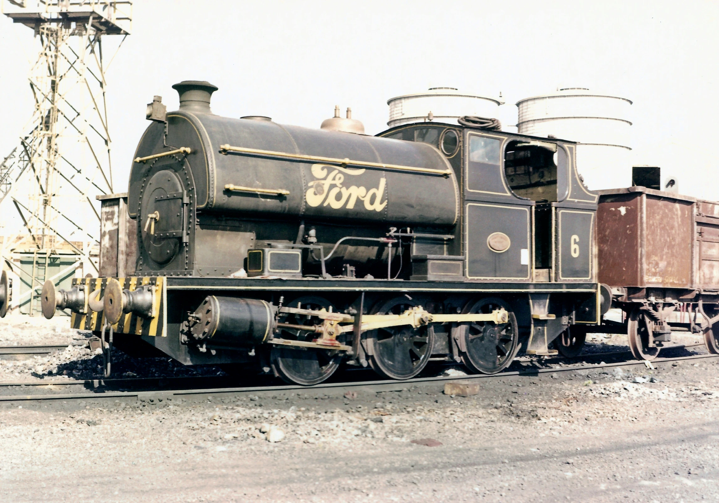 there is a old train sitting on the railroad tracks