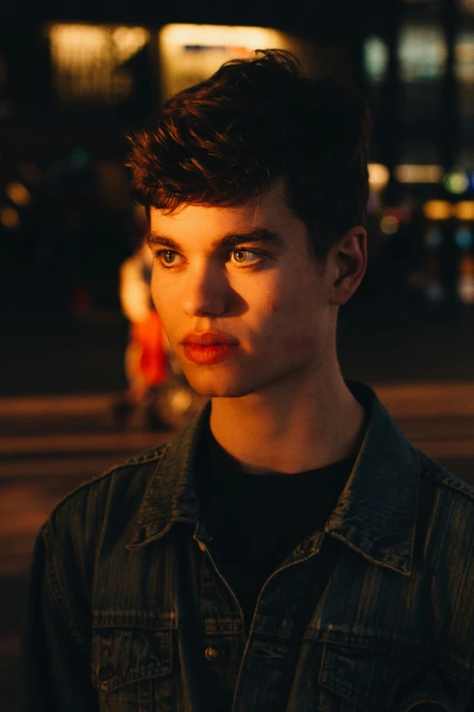 a young man poses for a picture while staring