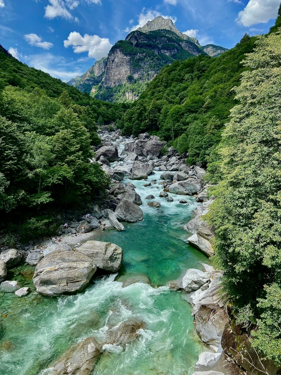 a river flowing under a mountain range