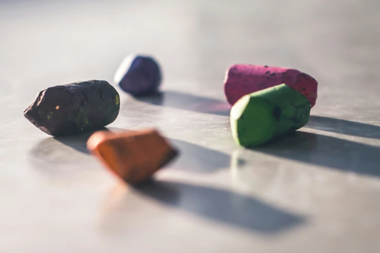 several different colored rocks are lying next to each other