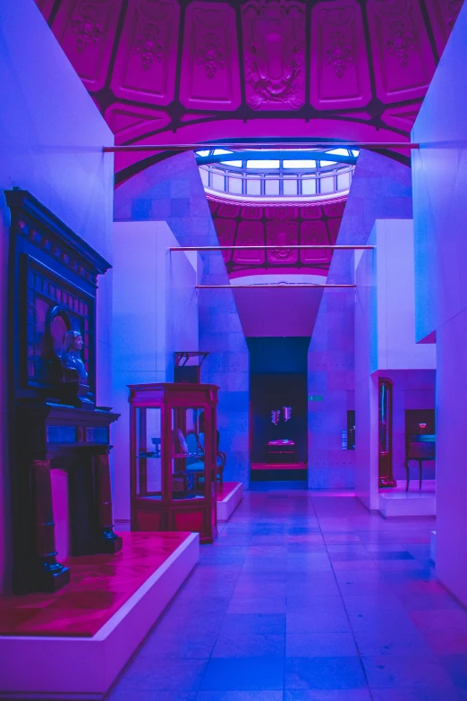 the hall is brightly lit with purple and red light