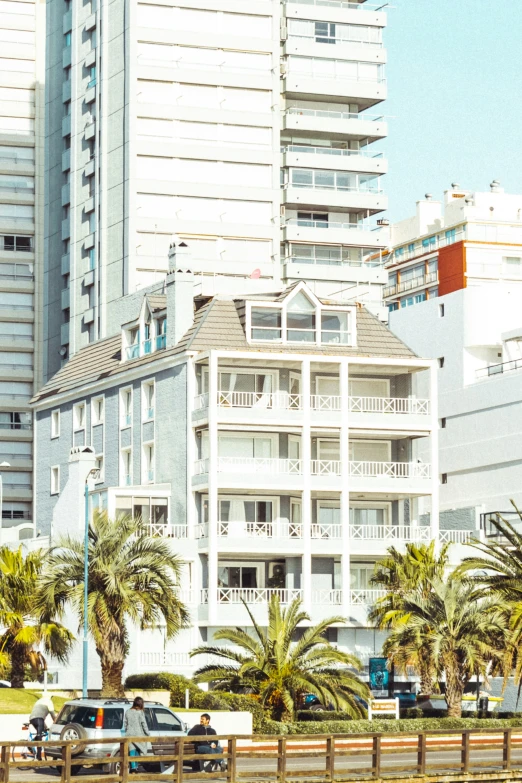 a building with cars parked on a street