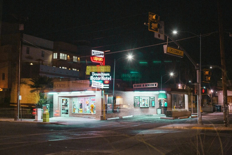 the storefront for dollar mart, lit up at night